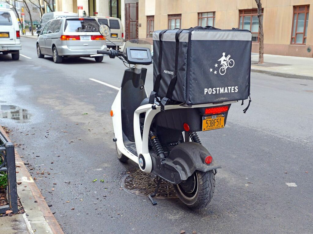 uber acquista postmates