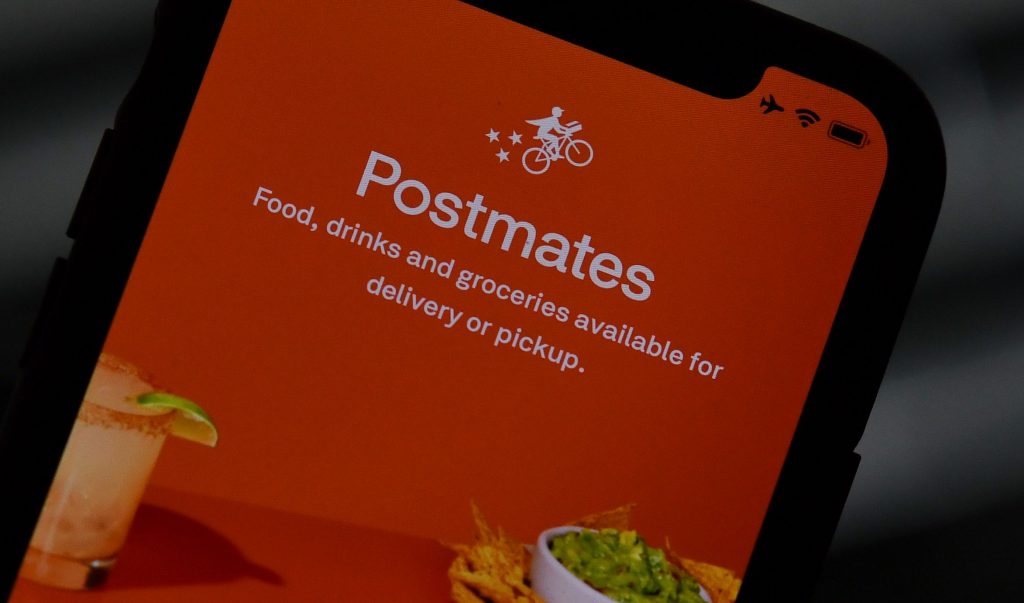 uber acquista postmates